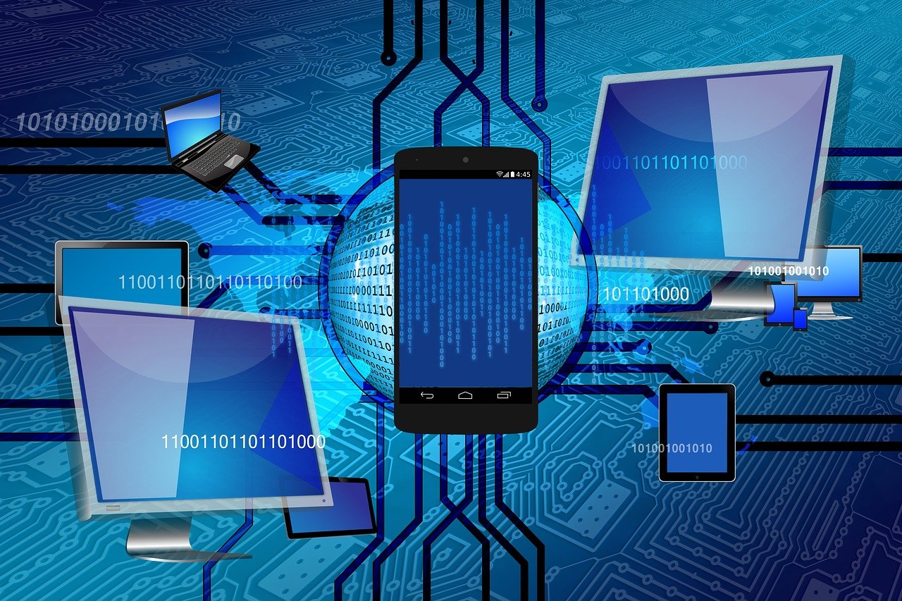 Image of monitor lap top and cell screens with lines between the screens binary 01